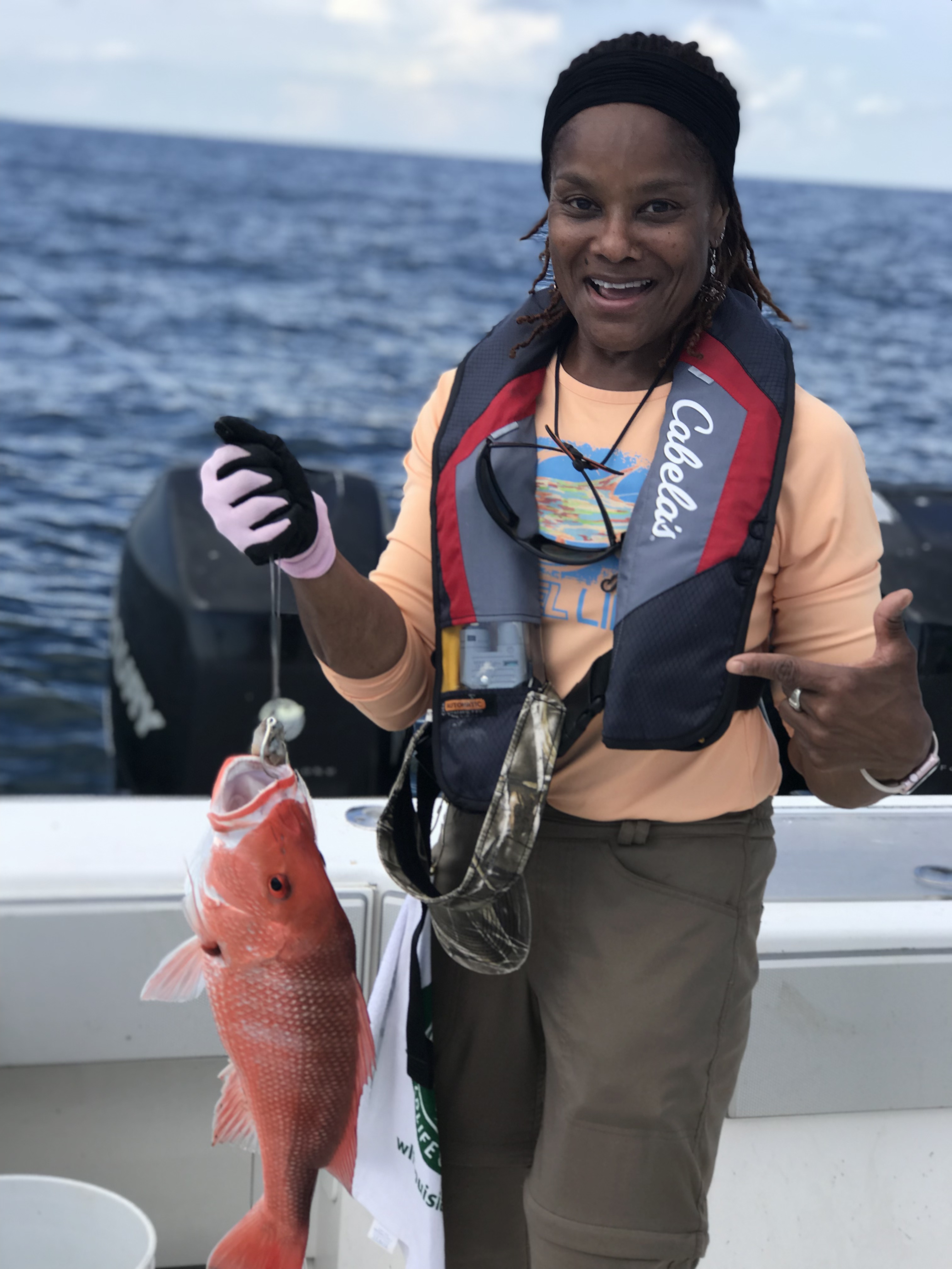 Participant with her catch during an offshore trip at the summer weekend workshop. 